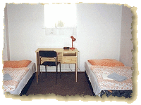 A hotel room with two beds